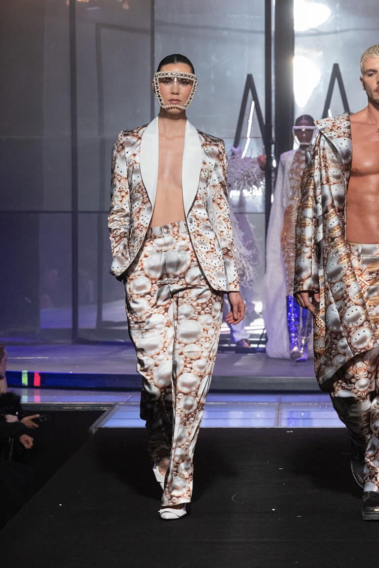 A model walk on aura tout vu show wearing custom print pearls tuxedo and printed pants